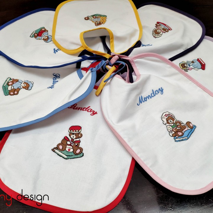 Set of 7 English embroidered baby bibs